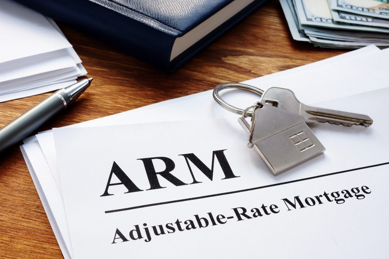 Adjustable Rate Mortgage ARM papers in the office. adjustable rate mortgage